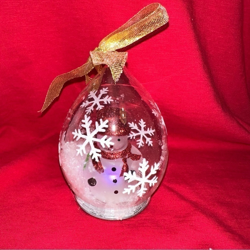 Glass Snowman ornament. Lights up and changes color.  New in box